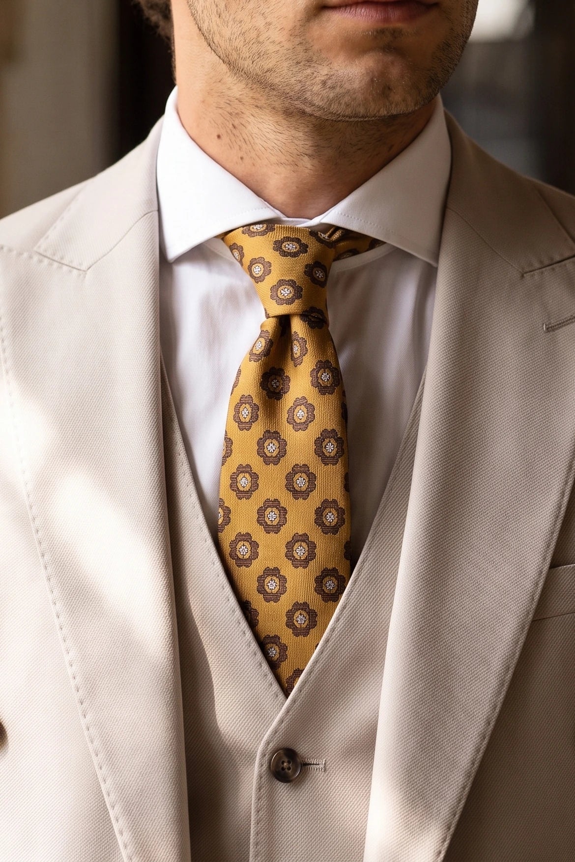 Herreslips i guld med paisleymotiv