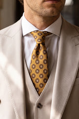 Herreslips i guld med paisleymotiv