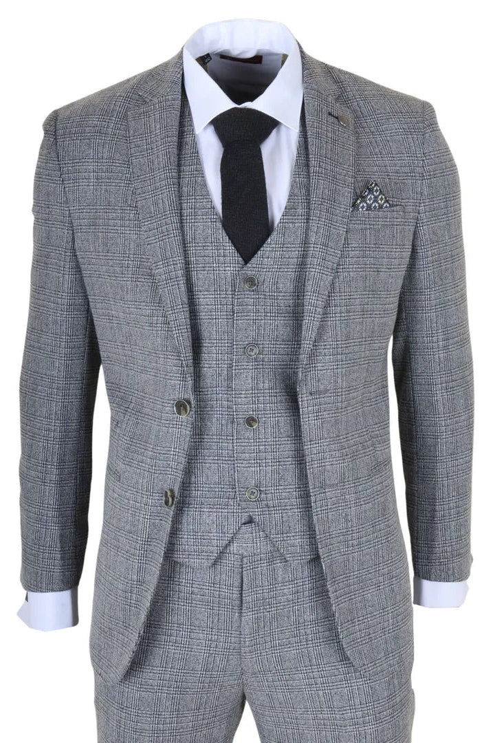 Gray checkered suit with a white shirt, black tie, and pocket square on a white background